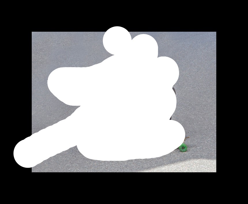 In this image a man is on a crouched position on a skateboard. He put his hand on the road. He is wearing glove and helmet.