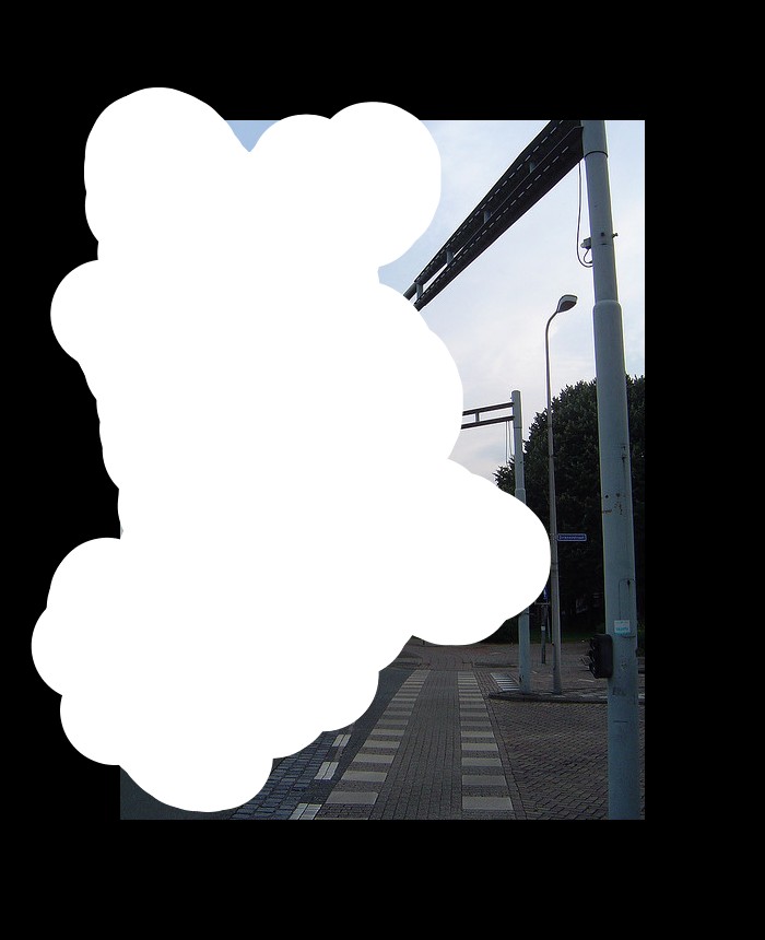 In the image we can see that, there are vehicles on road. There are light poles, trees and the sky is in pale blue color. This is a instruction pole.